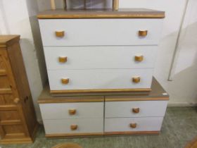 A laminated chest of three drawers together with a matching pair of two drawer chests