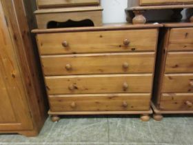 A modern pine four drawer chest