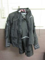 A Jofama motorcycle jacket and trousers with built in protection, size S