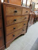 A Victorian mahogany chest of two short over three long graduated drawers on bracket supports