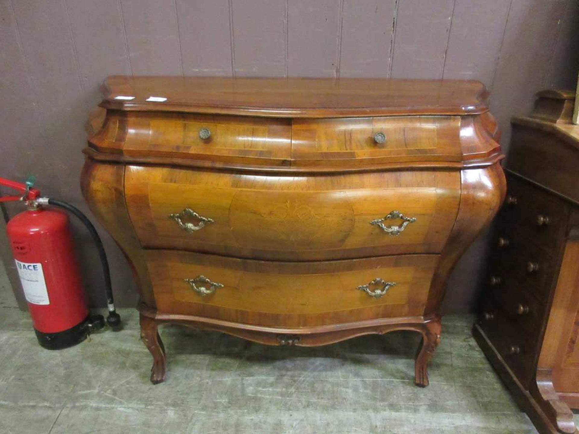 A modern French style Bombé commode with two short over two long drawers, approx. 114cm wide