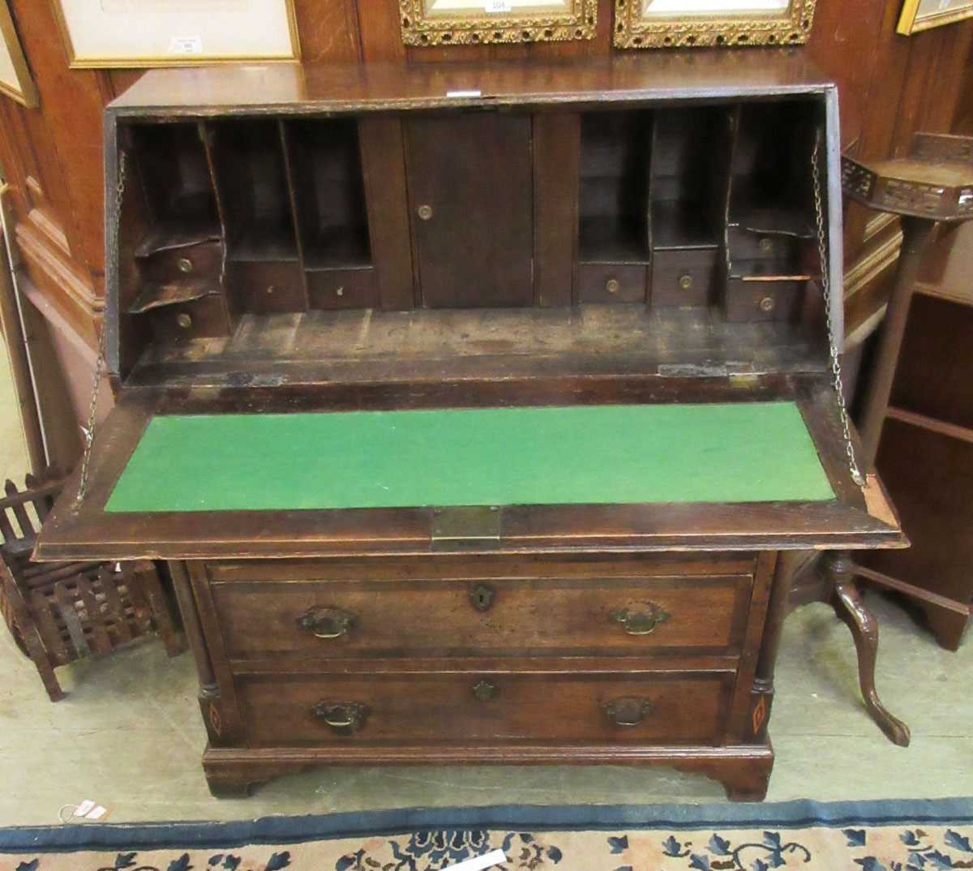 A George III oak bureau, the fall front with brass escutcheon above an inlaid marquetry conch shell, - Image 3 of 4