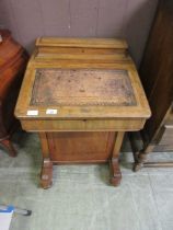 A Victorian walnut and cross banded Davenport with tooled leather writing surface (A/F)