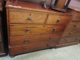 A Victorian mahogany chest of two short over three long graduated drawers on turned feet, 109.5cm