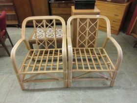 A pair of cane conservatory seats
