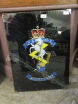 Foil backed image of insignia of the Royal Electrical and Mechanical engineers