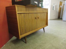 An Everest mid-20th century sideboard with helix pattern doors, on short feet, width; 137cm