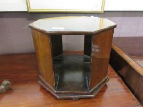 An early 20th century tabletop revolving bookcase, 31cm diameter