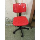 A red plastic office chair