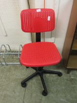 A red plastic office chair
