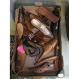 A box of assorted sized wooden shoe lasts