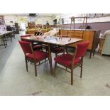 A mid-20th century Everest extending dining table with a set of four matching chairs