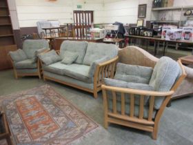 A mid-20th century style light Ercol style conservatory suite comprising of three seater sofa and
