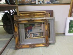 A large assortment of picture frames, framed and glazed needlework, etc
