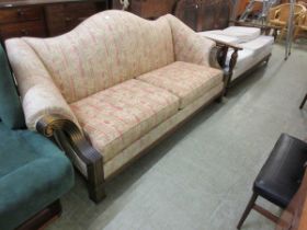 A large three seater settee with scroll over reeded arms and hump back, approx. 214cm wide