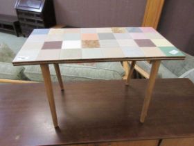 A mid-20th century style tile topped teak occasional table