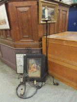 A wrought iron fire screen with map under glass panel along with a framed and glazed print of