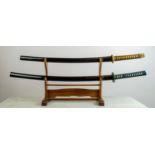 JAPANESE SAMURAI SWORDS, two, World War II period, with shagreen bounded handles in original black