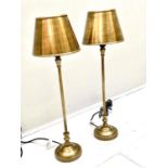 LIBRARY LAMPS, a pair, 64cm H x 20cm diam., gilt finish, with shades. (2)