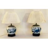 TABLE LAMPS, 58cm H, a pair, Chinese blue and white ceramic of jar form with carved wooden bases and