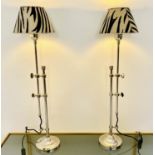 LIBRARY LAMPS, a pair, 68cm high, 20cm diameter, height adjustable with zebra print shades. (2)