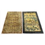 TIBETAN RUGS, two, to include a dragon design rug 185cm x 121cm and one other 185cm x 124cm. (2)