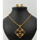 CHANEL GOLD CC LOGO NECKLACE AND BLACK CC LOGO STUD EARRINGS. (3)