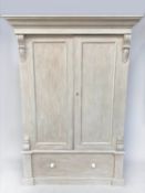 WARDROBE, 19th century, traditionally grey painted, with two doors enclosing hanging space above a