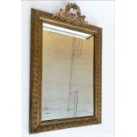 OVERMANTEL MIRROR, late 19th/early 20th century French giltwood and gesso moulded with quiver and