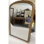 OVERMANTEL MIRROR, Victorian giltwood and gesso moulded of arched outline with beaded and moulded