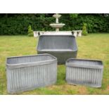 GARDEN PLANTERS, a graduated set of three, galvanised, largest measuring 33cm H x 60cm W x 24cm D,