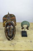 AFRICAN GURO TRIBAL MASK, ALONG WITH A BAMUM PEOPLE CURRENCY BRACELET. (2)