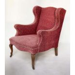 WING ARMCHAIR, early 20th century deep seated of serpentine top and front with faded rose weave