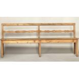 HALL BENCH, 19th century French provincial pine with raised bar back and swept front supports, 214cm