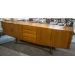 JOHANNES ANDERSON SIDEBOARD, circa 1960, 240cm x 49.5cm x 85cm, Danish teak, with four drawers