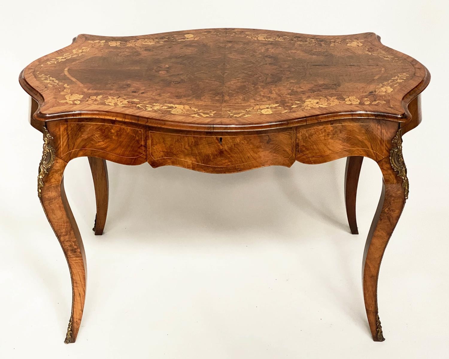 BUREAU PLAT, 19th century French Louis XV style burr walnut and gilt metal mounted with frieze