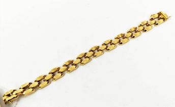 AN 18CT GOLD NUGGET MOTIF BRACELET, 19cm long, 24 grams.