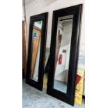 ANDREW MARTIN WALL MIRRORS, a pair, 80cm W x 220cm H rectangular ebonised with a bevelled plate. (2)