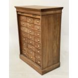 FILING CHEST, early 20th century oak with twenty four filing drawers and draw down tambour front,