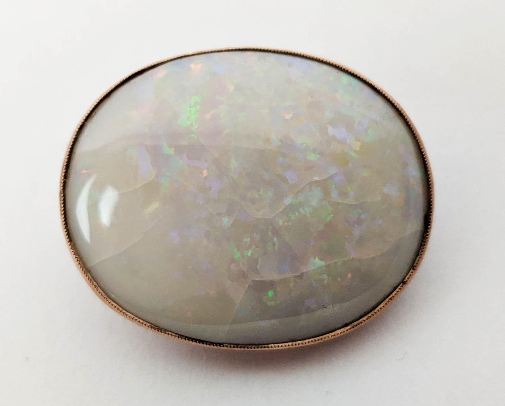 A YELLOW METAL AND OPAL SET BROOCH, probably 9ct rose gold, spiders web design to back, the oval - Bild 5 aus 6
