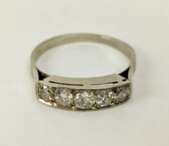 A FIVE STONE DIAMOND RING, tests as white gold, the channel set stones of graduated size, the