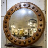 CONVEX MIRROR, 118cm diam., Regency style, oak and mahogany frame with studded detail.
