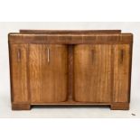 ART DECO DRINKS CABINET, oak with rounded top and pair of doors enclosing fitted interior and