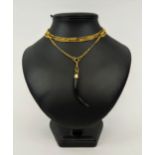 AN 18CT GOLD ALBERT CHAIN, with a ebony tusk pendant, 142 cm / 56 inches long, total gold weight, 35