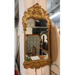 GILT METAL WALL MIRROR, baroque style, 99cm H x 45cm W.