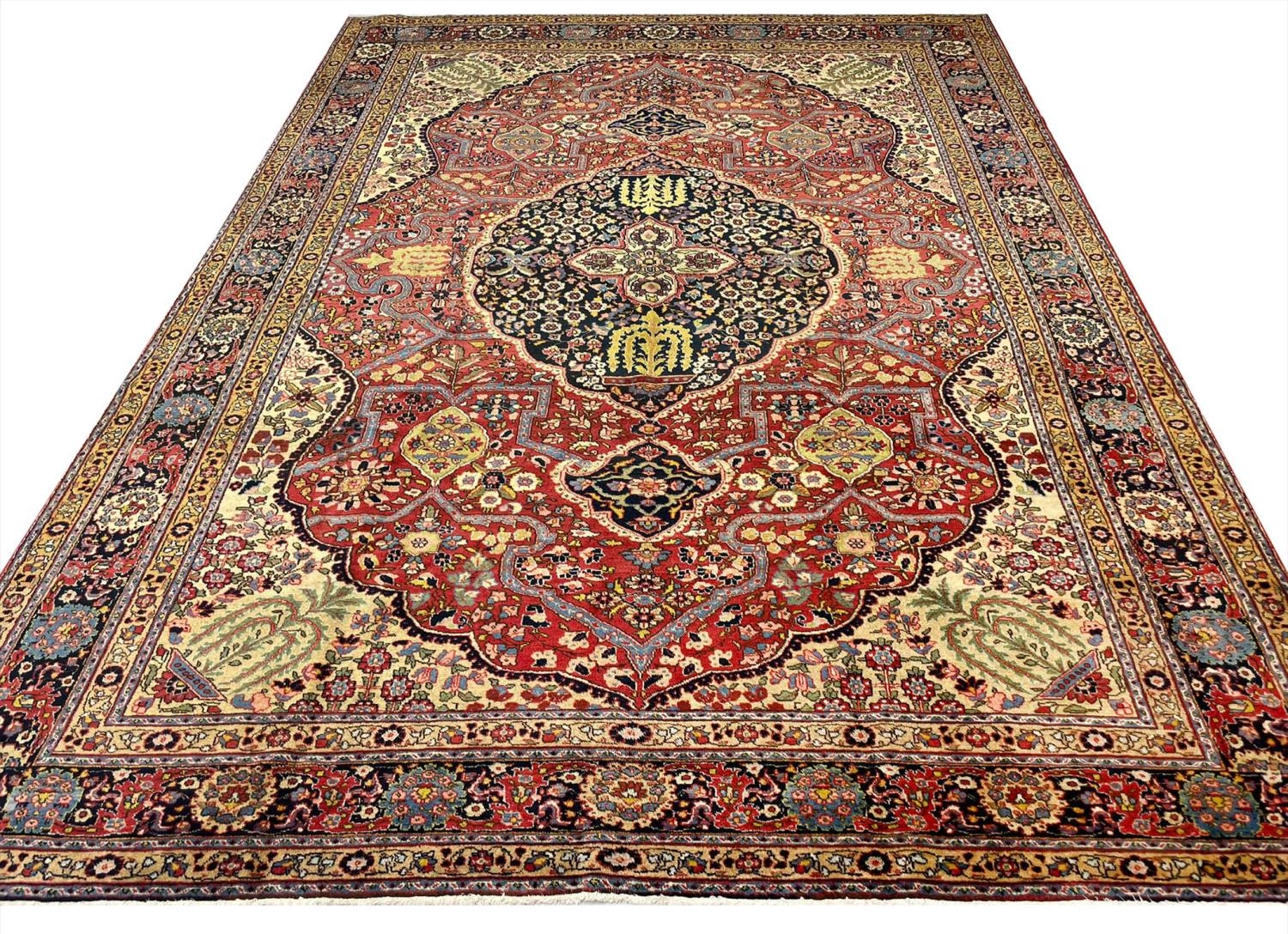 ANTIQUE PERSIAN TABRIZ CARPET, 385cm x 275cm.