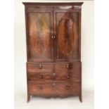 LINEN PRESS, George III flame mahogany with oval panelled doors enclosing original trays and well