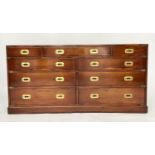 CAMPAIGN LOW CHEST, yewwood and brass bound with nine drawers, 150cm x 73cm H x 43cm.