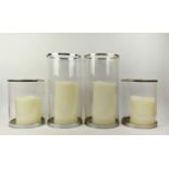RALPH LAUREN HOME HURRICANE LANTERNS, a set of four, with faux candles, 45.5cm H at largest. (4)