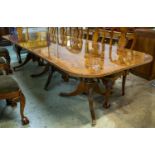 TRIPLE PEDESTAL DINING TABLE, Regency style, burr walnut, with crossbanded top and one extra leaf,